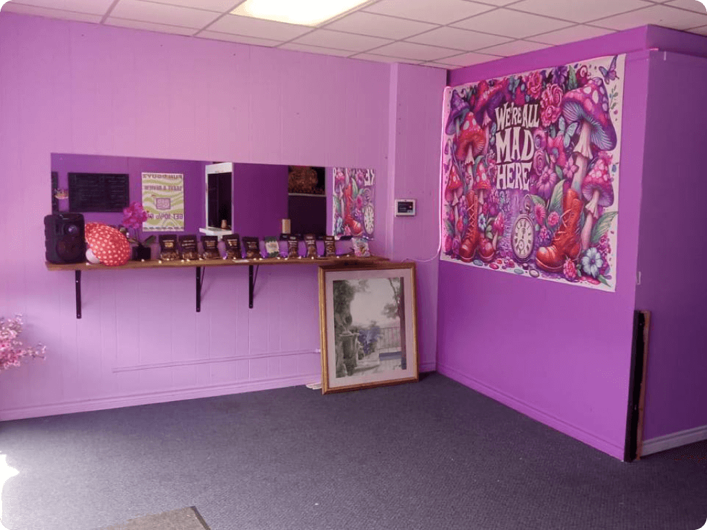 The interior of Funguyz magic mushroom dispensary in Welland, purple walls
